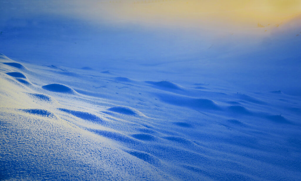 Sunset on snow. Snow Farm cross ski area, New Zealand