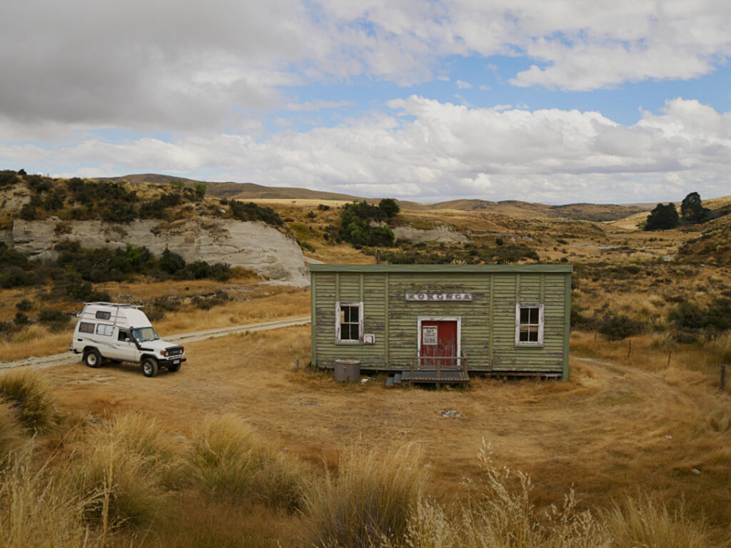 Old kokonga railway station, now resited to Okeake Conservation Park, Central Otago NZ. With Land Cruiser camper to the left