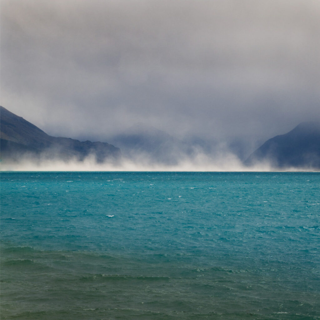 Dust storm coming down the Tasman River and onto Lake Pukaki. New Zealand