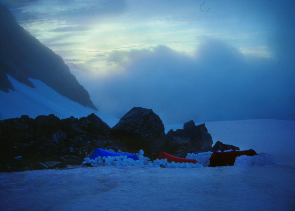 Tents on Forgotten River Col. Olivine Ice Plateau wilderness. Mt Aspiring National Park. New Zealand